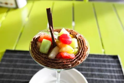 Ice cream with fruit pulp. Table setting in a restaurant. Stock Photos