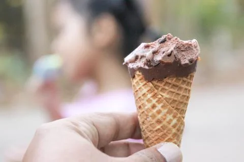 Ice cream on hand. Stock Photos