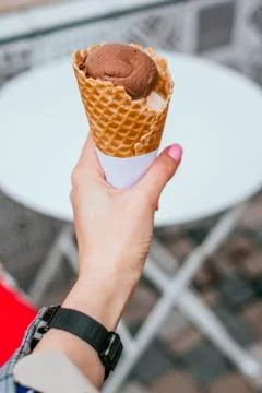 Ice cream in hands Stock Photos