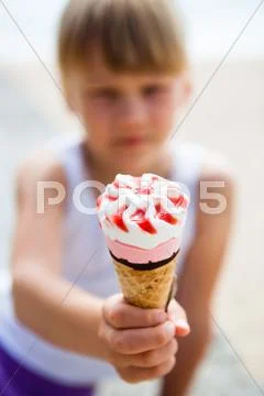 Ice cream held by young girl Stock Photos