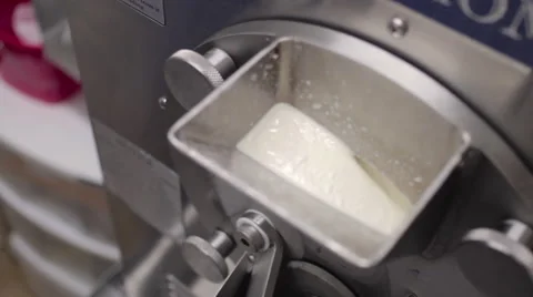 Ice cream machine churning vanilla ice cream Stock Footage
