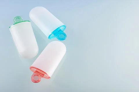 Ice cream molds lying on light grey surface, right space for text Stock Photos