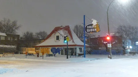 Ice cream place during snowfall Stock Footage 125554964