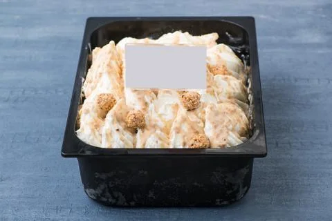 Ice cream in a plastic container Stock Photos