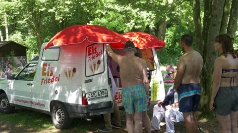Ice cream queue from a mobile gelateria in the forest Stock Footage 76928826