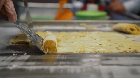 Ice cream rolls preparing on cold plate table, Thai style street food Video stock 223061844