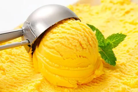 Ice cream scoop with mint leaf garnish Stock Photos