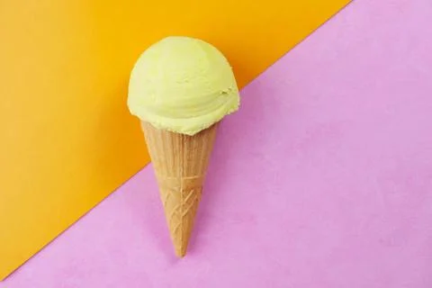 Ice-cream scoop waffle cone on bright background Stock Photos