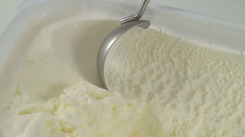 Ice cream scooping out of container Stock Footage 74698136
