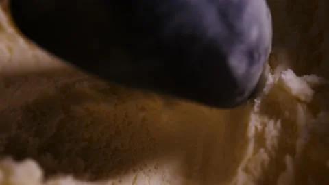 Ice cream scoopper digs into vanilla ice cream to serve dessert close up Stock Footage 150918805