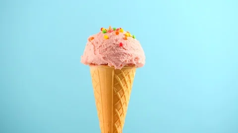 Ice cream. Strawberry or raspberry flavor icecream in waffle cone rotated Stock Footage 88189199