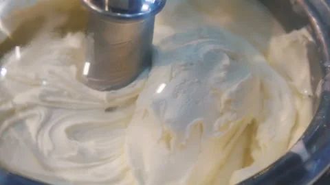 Ice cream swirl in the ice cream machine in 4k slow motion 60fps Stock Footage