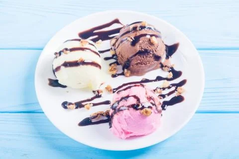 Ice cream with walnuts and chocolate topping Stock Photos