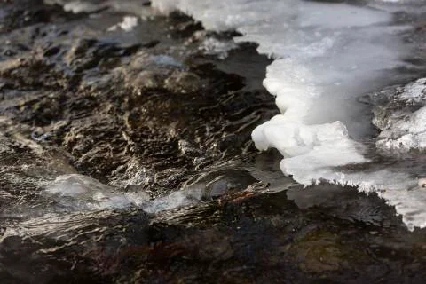The ice crusted Holderbach mountain river in the northern Eifel in winter, Ge Stock Photos