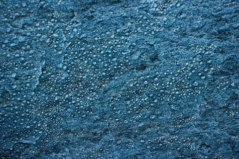 Ice crystals forming pattern on stone. 스톡 사진