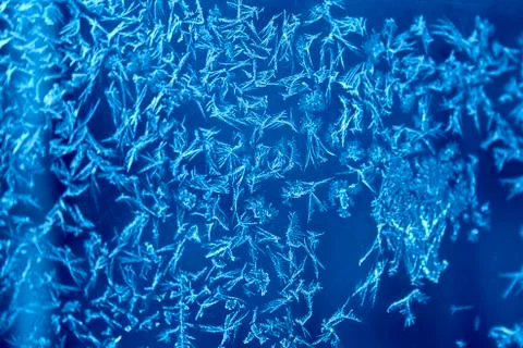 Ice crystals pattern on the window Stock Photos