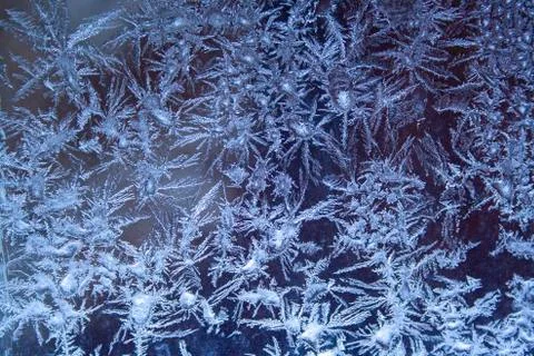 Ice crystals pattern on the window Stock Photos