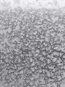 Ice crystals on surface on home window glass Stock Photos