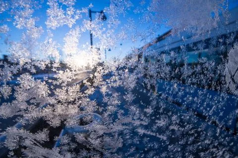 Ice crystals on a window backlit by the sun.. Foto stock