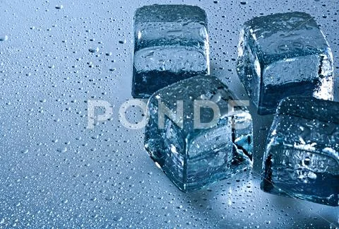 Ice Cube And Water Drops On The Wet Background