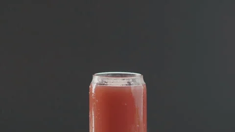 Ice cube beautifully slowly falls into summer cocktail Stock Footage 97754352