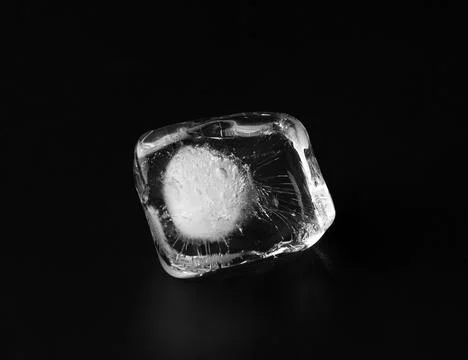 Ice cube on black background Stock Photos