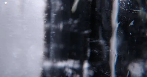 Ice cube closeup over black background. 스톡 동영상 333018363