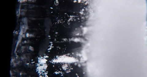 Ice cube closeup over black background. 스톡 동영상 333018827