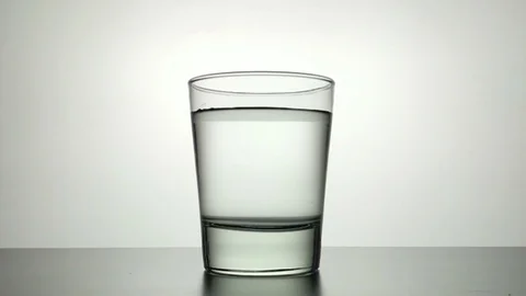 Ice cube drop in water slow motion Stock Footage 91016184