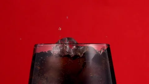 Ice Cube Falling Into Drink In Macro Shot Stock Footage 151622830