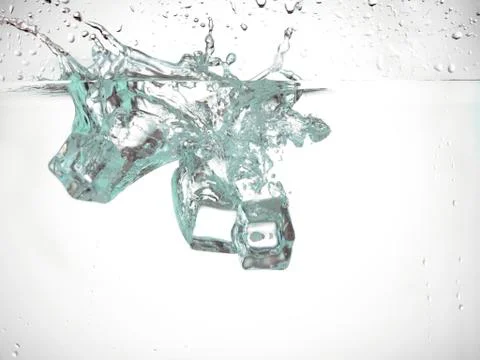 Ice cube falling under the water Stock Photos