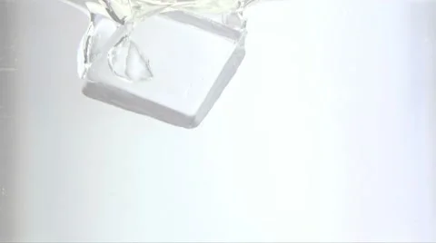 Ice Cube Falling in to the Water from Above Slow Motion 2 Stock Footage 8960913