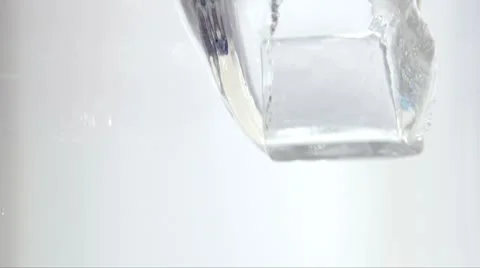Ice Cube Falling in to the Water from Above Slow Motion 1 Stock-Footage 8963175