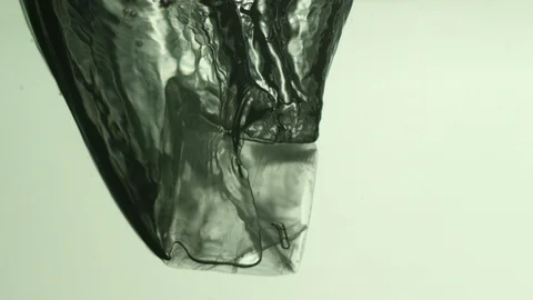 Ice cube falling into water Video stock 104649783