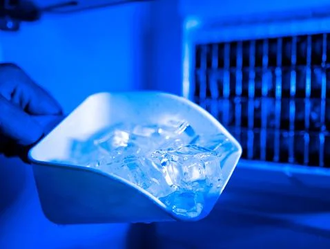 Ice cube maker machine for home cafe bar kitchen catering equipment. Stock Photos