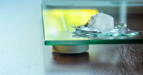 Ice cube melt on glass surface 库存影片 66829205