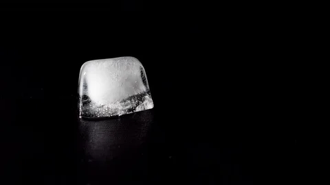 Ice cube melting Stock Footage 73871952