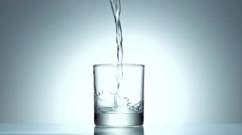 Ice cube splash in glass of water, slow motion Video stock 21430749