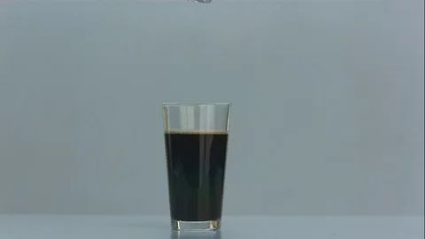 Ice Cube Splashes Into Glass of Nitro Cold Brew Coffee in Slow Motion 스톡 동영상 75122053