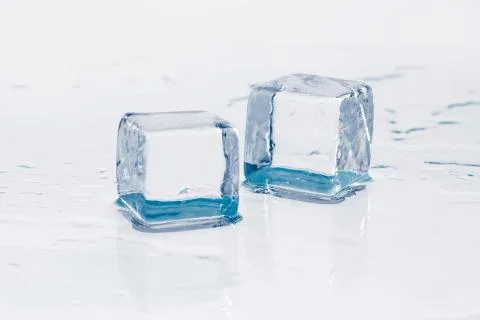 Ice cube on table Stock Photos