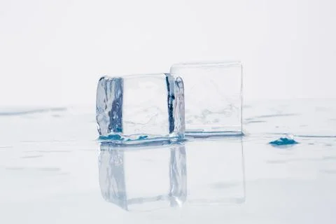 Ice cube on table Stock Photos