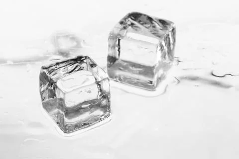 Ice cube on table Stockfoto's