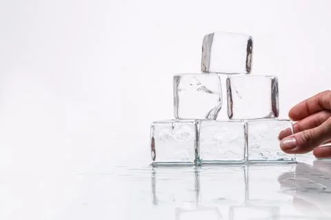 Ice cube on table 스톡 사진