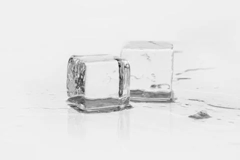 Ice cube on table Stock Photos