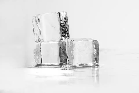 Ice cube on table Stock Photos
