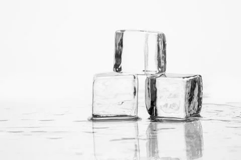 Ice cube on table Foto stock