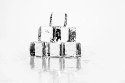 Ice cube on table Stock Photos