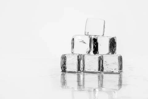 Ice cube on table Stock Photos