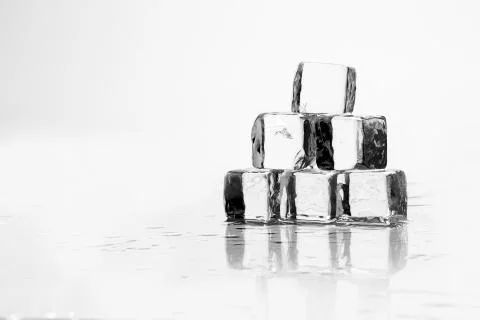 Ice cube on table Stock Photos