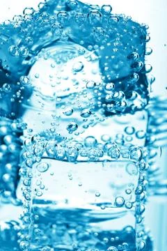 Ice cube in water bubbles Stock Photos